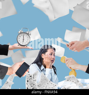 Composite image of hand holding alarm clock Stock Photo