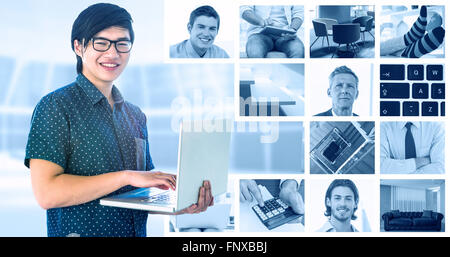Composite image of smiling hipster businessman using tablet Stock Photo