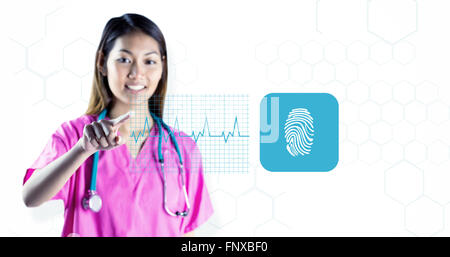 Composite image of asian nurse with stethoscope pointing in front of her Stock Photo