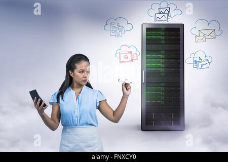 Composite image of serious businesswoman with calculator writing with pen Stock Photo