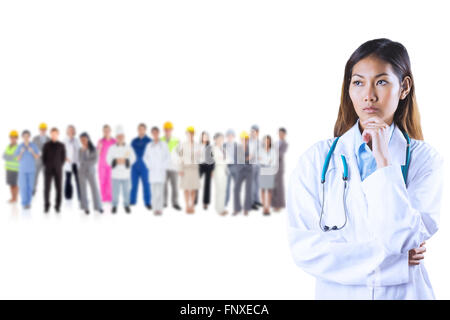 Composite image of focused asian woman thinking Stock Photo