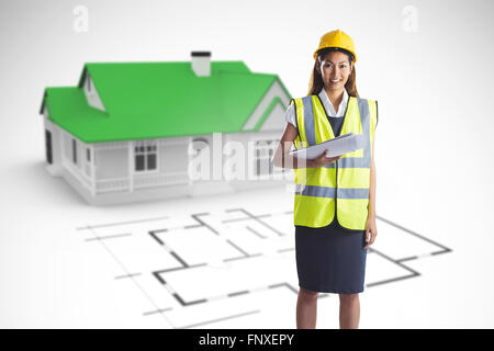 Composite image of architect woman with yellow helmet and plans Stock Photo