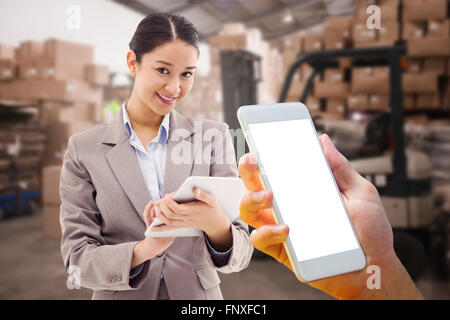 Composite image of hand holding smartphone Stock Photo
