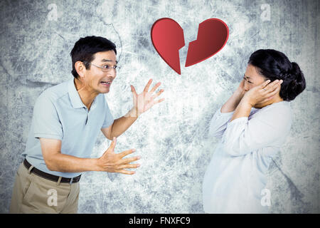 Composite image of older asian couple having an argument Stock Photo