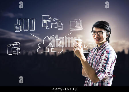 Composite image of smiling creative businessman with take-away coffee Stock Photo