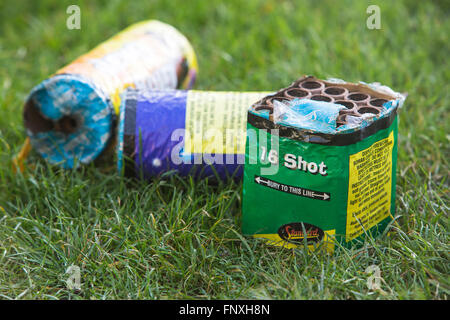 Fireworks and sparklers left overnight in a garden after a family firework display on November the 5th, Bonfire night in the UK. Stock Photo