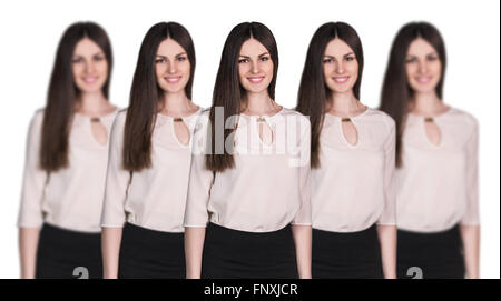 Women clones standing in a row Stock Photo