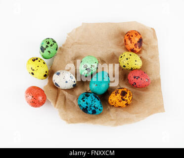 Easter eggs on the background of wrapping paper. Bright colorful Easter still life. Stock Photo