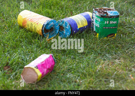 Fireworks and sparklers left overnight in a garden after a family firework display on November the 5th, Bonfire night in the UK. Stock Photo