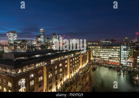 St Katherine's Dock Marina with boats and yachts at night, London UK Stock Photo