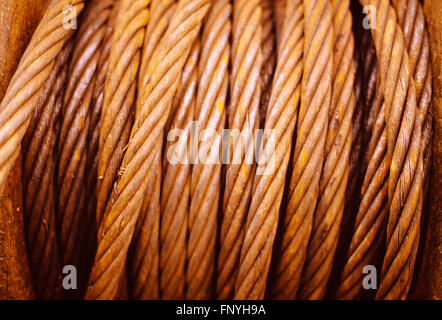 Rusty coiled steel metal winch cable Stock Photo
