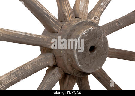 Left front closeup view of hub and spokes of vintage weathered wooden wagon wheel Stock Photo