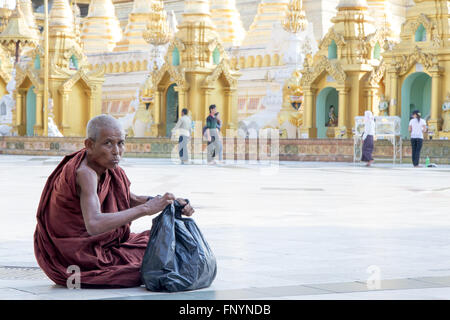 monk in The Shwe dagon Pagoda Stock Photo
