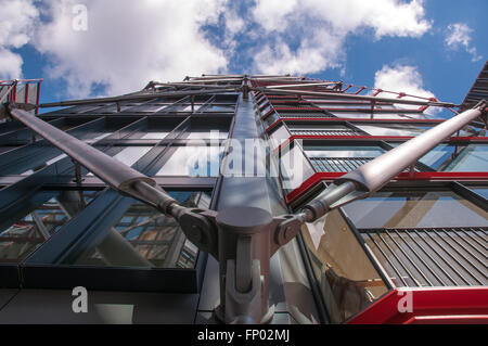 Modern abstract pattern of new glass building facade blue sky clouds London UK Stock Photo