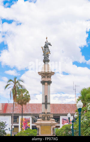 Low angle view of independence monument with decorated neoclassical style column and a man statue at top at the historic center Stock Photo