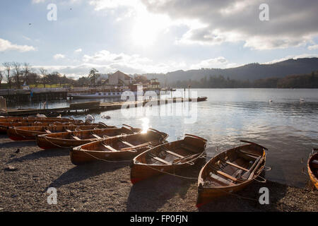Lake Windermere, Cumbria, UK. 16th March, 2016. UK Weather: Lake Windermere -  Bowness Bay -Late aftrenoon -Last of the sun -the traditional rowing boats being got ready for Easter  & the steamer The Tern (built 1891) in the background   Credit:  Gordon Shoosmith/Alamy Live News Stock Photo