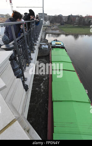 Drazdany, Germany. 16th Mar, 2016. Czech freighter is stuck in front of the pillars of Albert Bridge on the Elbe river in Dresden, Germany, March 16, 2016. A strong current had prevented the 'Albis' carrying 800 tons of salt from passing. The bridge arches have been suspended for shipping traffic since the incident occurred. © Libor Zavoral/CTK Photo/Alamy Live News Stock Photo