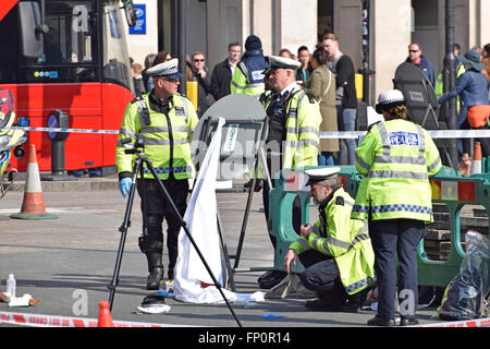 London, UK. 17th March, 2016. Most of Parliament Square is closed to traffic as police inspect the scene of a serious accident involving a double decker bus during the rush hour. The helicopter air ambulance was called and she was treated for head and leg injuriesbefore being taken to a trauma centre by ground ambulance Credit:  PjrNews/Alamy Live News Stock Photo