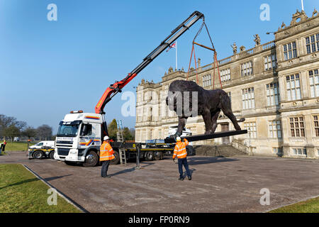 Longleat House, Wiltshire, UK. 17th March, 2016. A magnificent sculpture of a lion by African based sculptor Bruce Little which was commissioned by Ceawlin Thynn, Viscount Weymouth of Longleat, was today unveiled in front of Longleat House in Wiltshire as part of the 50th anniversary celebrations at Longleat. The 8m long by 4.3m tall statue has been sculpted in bronze in Africa. Credit:  Andrew Harker/Alamy Live News Stock Photo