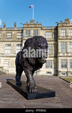 Longleat House, Wiltshire, UK. 17th March, 2016. A magnificent sculpture of a lion by African based sculptor Bruce Little which was commissioned by Ceawlin Thynn, Viscount Weymouth of Longleat, was today unveiled in front of Longleat House in Wiltshire as part of the 50th anniversary celebrations at Longleat. The 8m long by 4.3m tall statue has been sculpted in bronze in Africa. Credit:  Andrew Harker/Alamy Live News Stock Photo