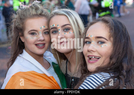 Belfast, Ireland. 17th March, 2016. Teenage Girls with Tri Color wrapped around them at the Saint Patrick's Day Celebrations take place in Belfast Credit:  Bonzo/Alamy Live News Stock Photo