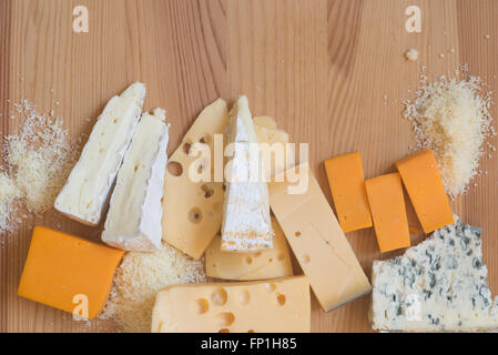 different types of cheese on wooden table Stock Photo