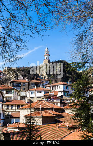 Historical clock tower in Goynuk with traditional Ottoman style house around.Goynuk is a town and a district of Bolu Province in Stock Photo