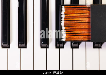 Detail of piano keyboard and luxury matchbox Stock Photo - Alamy