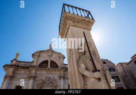 knight Orlando's Column in front of Saint Blaise's Baroque church at Luza Square on the Old Town of Dubrovnik city, Croatia Stock Photo