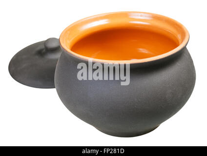 open ceramic pot from black unglazed clay and lid isolated on white background Stock Photo