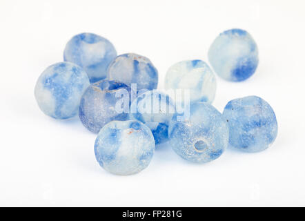 many beads from rough blue painted glass on white background Stock Photo