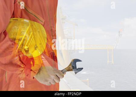 worker and oil rig double exposure concept Stock Photo