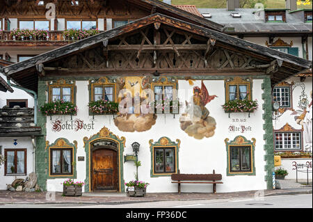 Lüftlmalerei mural of the Holy Trinity and St. Florian, Hotel and Gasthof Zur Alten Post, Wallgau, Werdenfels, Upper Bavaria Stock Photo