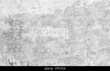 White concrete wall with white paint over stucco relief, background photo texture Stock Photo