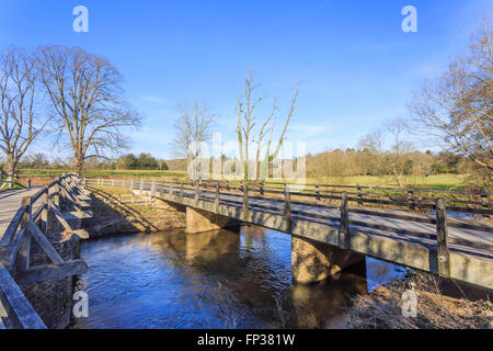 Tilford West Bridge, a scheduled monument medieval bridge over the River Wey, in the village of Tilford near Farnham, Surrey, UK Stock Photo