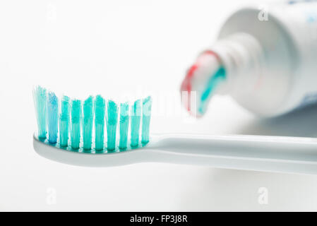 Toothbrush and toothpaste on white background close up. Stock Photo