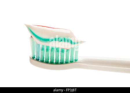 Toothbrush and toothpaste isolated on white close up. Stock Photo
