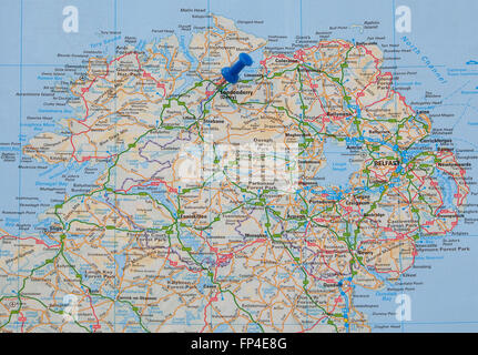 Road map of Northern Ireland, with a map pin indicating Londonderry (Derry). Stock Photo