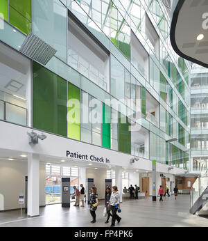 Multi-colored glazing in public concourse with patient check in. Southmead Hospital, Bristol, United Kingdom. Architect: BDP, 20 Stock Photo