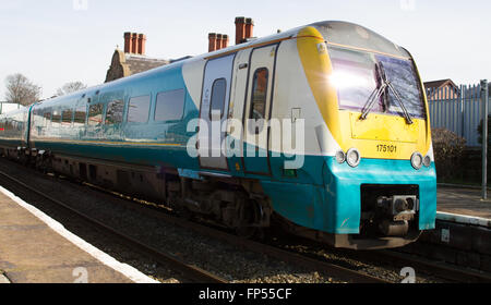 Arriva Trains Wales ATW Manchester to Llandudno service formed of Alstom built 3 car Class 175 leaving Helsby HSB station in Cheshire. Now TfW Keolis Stock Photo