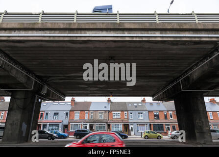 Urban landscape. A section of the elevated M4 motorway above the A4 road next to houses at Brentford, London, England, UK Stock Photo