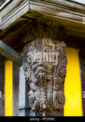 Carved wooden devil on the 17th century wood and plaster gatehouse at Stokesay Castle near Ludlow in Shropshire England UK