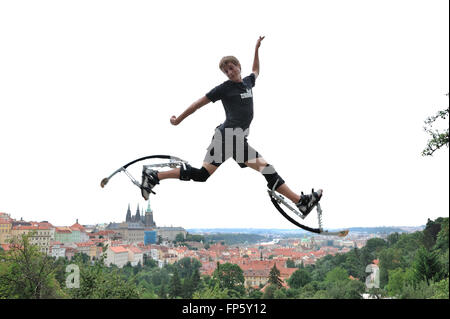 Young man on a jumping boots Stock Photo