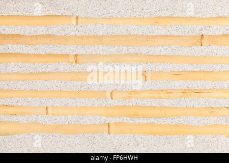 Bamboo in sand, natural background. Stock Photo