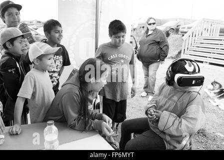 Native children experiencing virtual games in Northern James Bay Quebec Canada Stock Photo