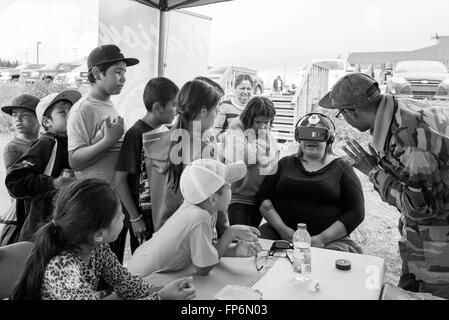 Native children experiencing virtual games in Northern James Bay Quebec Canada Stock Photo