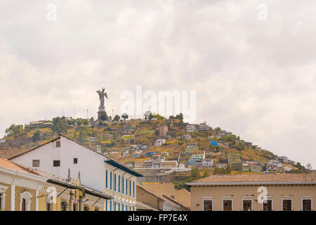 Low angle view of colonial classic style buildings and the famous panecillo hill at background in the historic center of Quito i Stock Photo