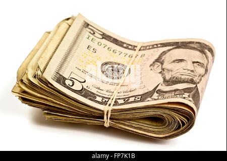 Five Dollar Bills With Rubber Band With Shadows Stock Photo