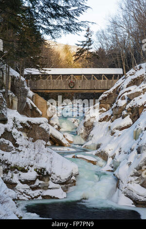 Franconia Notch State Park - Sentinel Pine Covered Bridge during the winter months. Stock Photo