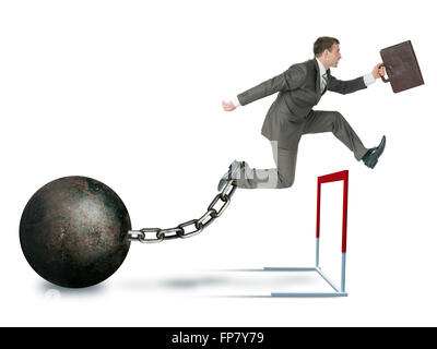 Businessman with iron ball hoppig over barrier isolated on white background, competition concept Stock Photo